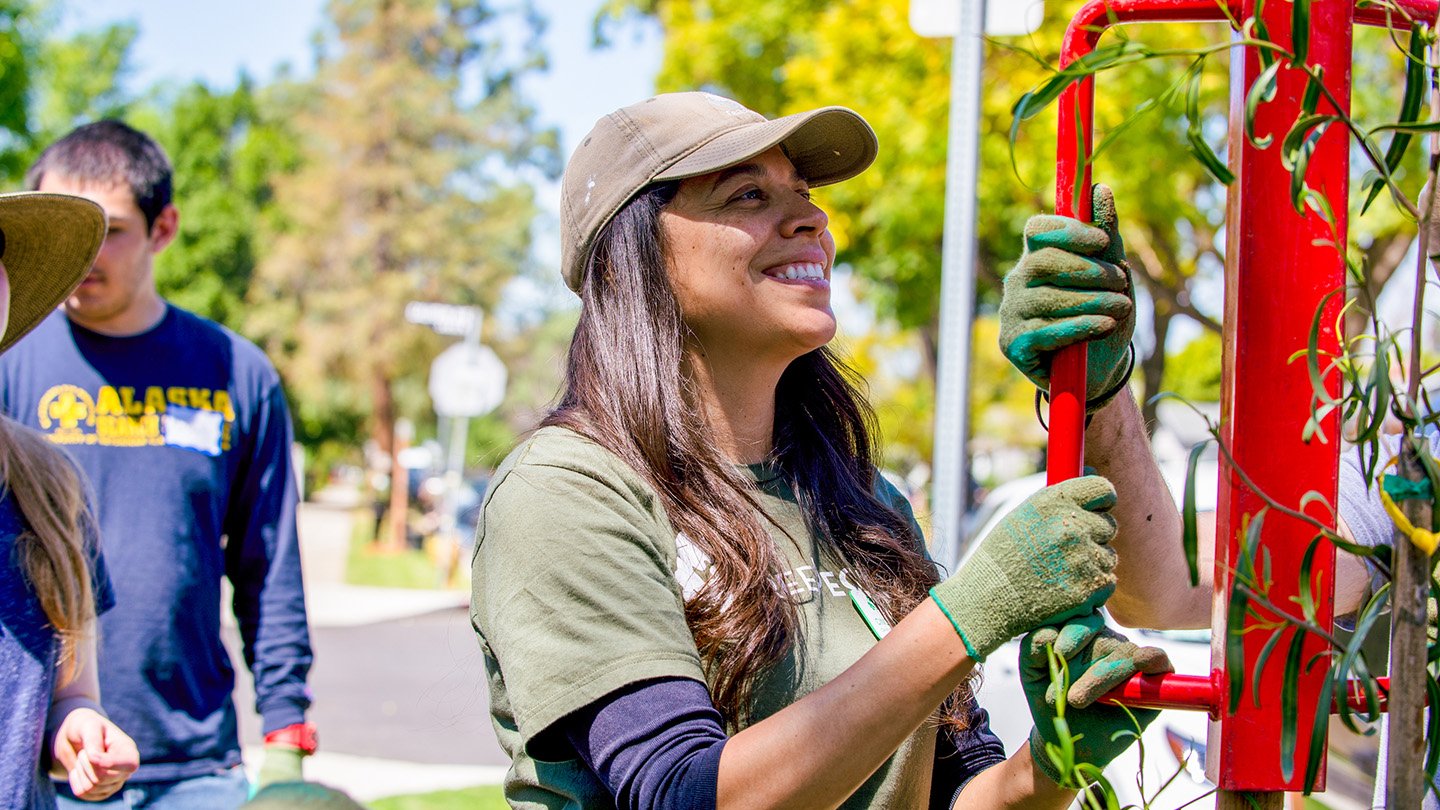 Cindy Montañez planting a tree